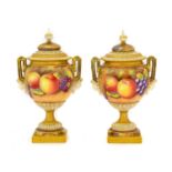 {} A Pair of Royal Worcester Porcelain Vases and Covers, 2nd half 20th century, by Leaman, of