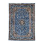 Kashan CarpetCentral Iran, circa 1970The Prussian blue field of palmettes and vines around a