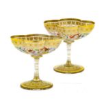 A Pair of Lobmeyer Style Glass Sweetmeat Dishes, circa 1900, the quatrefoil bowls enamelled with a