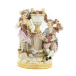 A Meissen Porcelain Figure Group, late 19th/early 20th century, as an 18th century couple flanking