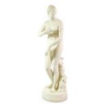 A Victorian Parian Figure of the Venus de Medici, after the Antique, standing before a tree stump, a