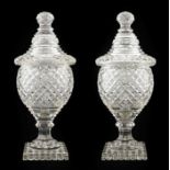 ~ A Pair of Anglo-Irish Cut Glass Vases and Covers, early 19th century, of ovoid form with allover