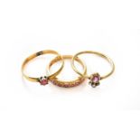 A synthetic ruby half hoop ring, stamped '750', finger size K1/2; an adapted 22 carat gold band