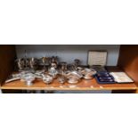 A group of silver and silver plate including, cased silver tea knives and teaspoons, a pierced