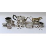 A collection of assorted silver, including: a seven-bar toastrack; a silver teapot; a sauceboat; a