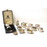 A collection of assorted silver, including: five napkin-rings; a pair of salt-cellars and a four-