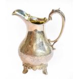 A Victorian Silver Cream-Jug, by John Walton, Newcastle, 1857, pear-shaped and on palmette and paw