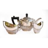 A Three-Piece Victorian Silver Tea-Service, by William Gibson and John Lawrence Langman,