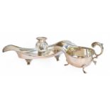 A George V Silver Inkstand, by Charles Boyton and Son Ltd., London, 1916, oval and on four scroll