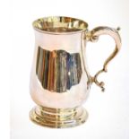 A George III Silver Mug, by Peter and Ann Bateman, London, 1790, baluster and on spreading foot,