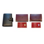 A Cartier filofax; a Must de Cartier lighter; a Pierre Cardin lighter; two Cartier wallets; a