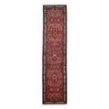 Saroukh Runner, West Iran, late 20th centuryThe soft peach field with a column of floral