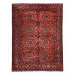 Afghan Turkmen Rug, modernThe claret compartmentalised field of salor güls enclosed by meandering