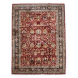 Large Indian Carpet, modernThe brick red field with an allover design of flowing vines and