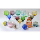 Two trays of coloured glass including harlequin hock glasses and paperweights: Okra, Caithness,