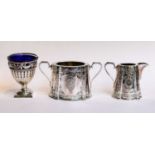 A silver blue glass lined sugar basket, four part Walker & Hall silver plated tea service, and a