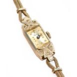 A lady's diamond set cocktail watch, signed Geneva, inside hinged back cover inscribed gold &