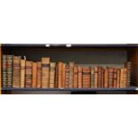 A collection of antiquarian books in leather bindings (full shelf)