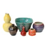 A collection of Chinese porcelain in coloured grounds, including a yellow double gourd vase, sang de