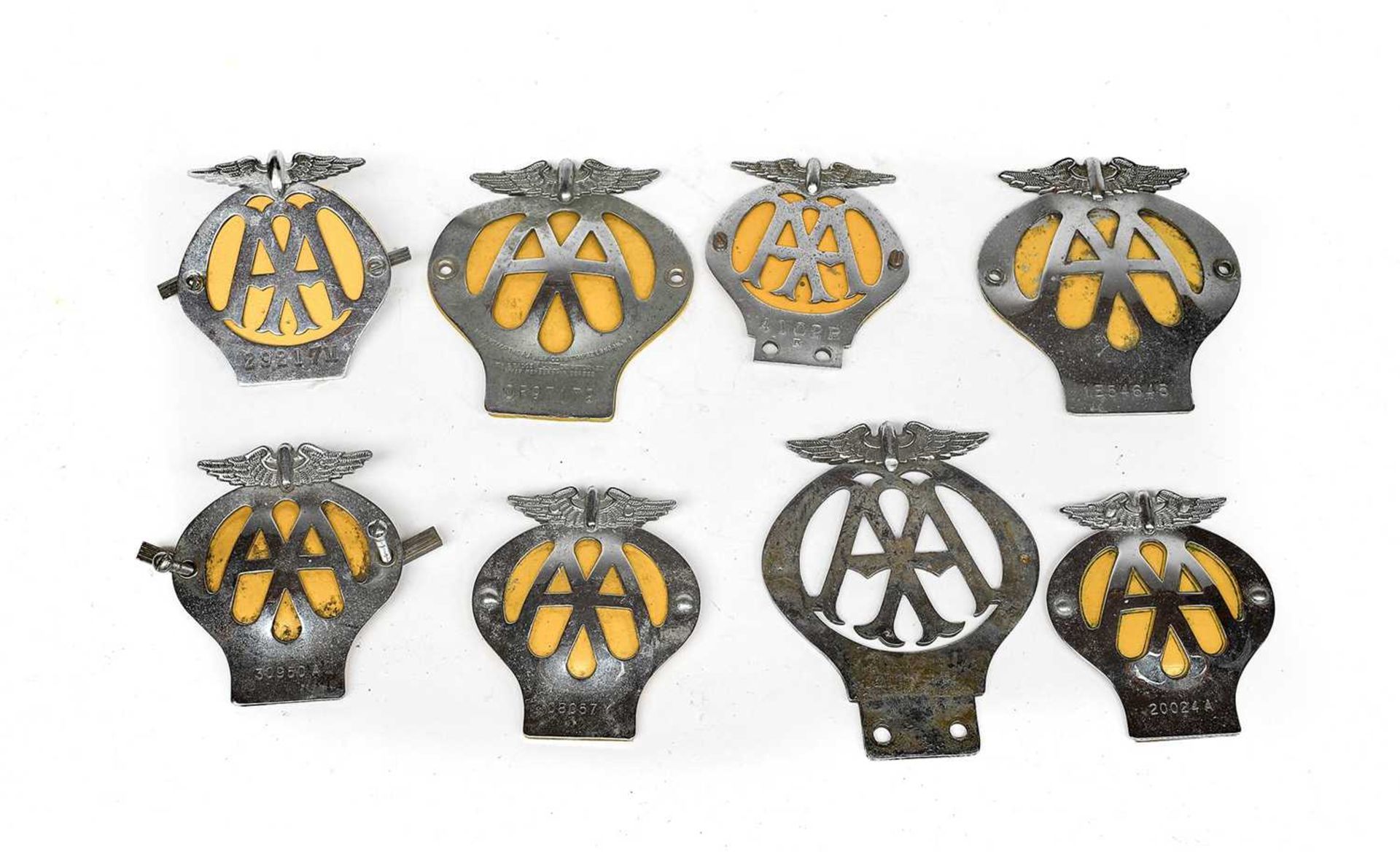 Eight Assorted Chromed Metal AA Members' Badges