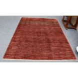 A modernist rug, the raspberry field with lattice design containing diamond medallions, 236cm by