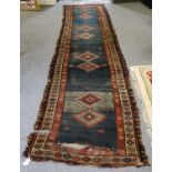 An Ersari Ensi rug, the quartered field of candelabra motifs enclosed by borders of cruciform