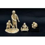 A Japanese Meiji period cavred ivory okimono modelled as a farmer and his son, raised on a simple