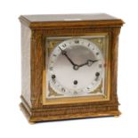 An oak cased striking Elliot mantel clock, and paperwork and key