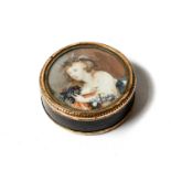 An early 19th century tortoise shell circular box and cover with gold plated mounts set with an