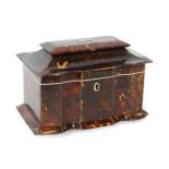A Regency Tortoiseshell tea caddy with pagoda top, scalloped front, and two lidded compartments