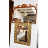 A Georgian style walnut wall mirror, with scroll and shell carved surmount, 64cm by 49cm; together