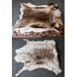 Two Reindeer hide rugs