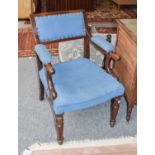 A pair of mid 19th century mahogany libarary chairs, one upholstered in blue, the other in green (