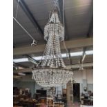 A large three light cut glass chandelier of tent and bag form with gilt metal frame, approx 130cm
