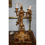 An early 20th century French gilt bronze five light candelabra, ornamented with putti and flower