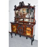 An Edwardian mirrored and carved sideboard, 140cm by 42cm by 220cm