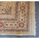 Oriental Carpet, probably Lahore, the cream field with central medallion framed by spandrels and