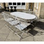 A French painted metal garden patio table, 178cm by 80cm by 80cm, including six folding chairs (7)