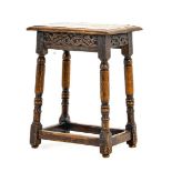 An Early 18th Century Oak Joint Stool, the moulded top of four-peg construction above a carved