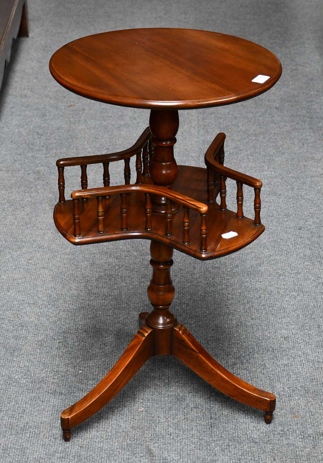 A mahogany occasional table with rotating lower gallery, 76cm