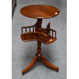 A mahogany occasional table with rotating lower gallery, 76cm