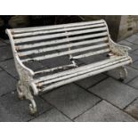A Victorian painted cast iron and wooden slatted scroll end garden bench decorated with leaves and