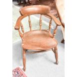 A 20th century elm smokers chair
