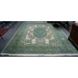 An oriental carpet, the cream field with semi-naturalistic floral sprays centred by a sky blue and