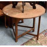 An 18th century oak circular drop leaf occasional table, 90cm open, by 69cm