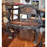 A 19th century ebonised and inlaid open armchair, the seat decorated with a bull fighting scene, (