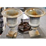 A pair of grey painted metal garden urns of flared and fluted form, 46cm (2)