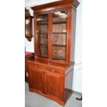 A 19th century bookcase cabinet, by repute made in Kirby Lonsdale, 113cm by 58cm by 234cm