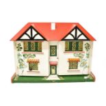 Circa 1930s Triang Dolls House, with double front opening doors enclosing four rooms and central