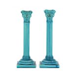 A Pair of Burmantofts Faience Pottery Corinthian Column Candlesticks, turquoise glaze, impressed B F